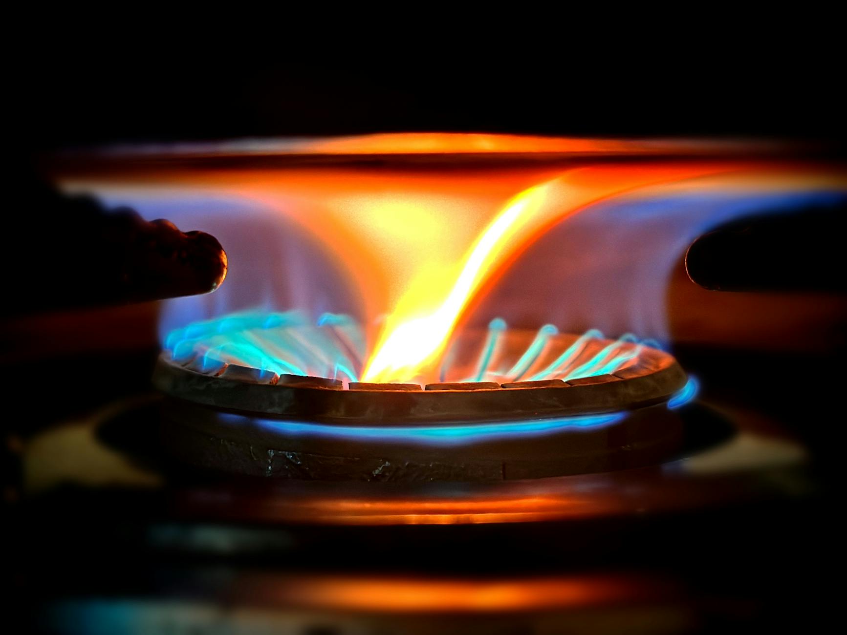 Licensed gas fitter at work — servicing a residential gas heater in Adelaide